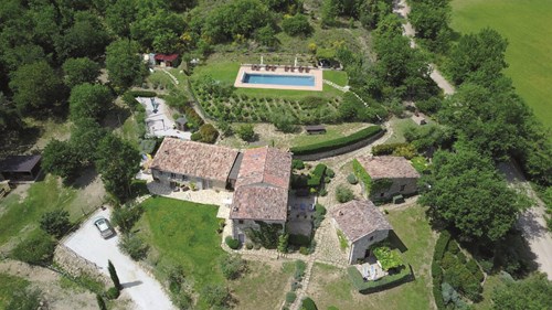 Aerial view of houses and outbuildings