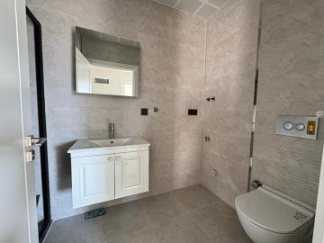 fully-tiled-modern-bathroom