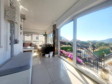 bright-and-spacious-glassed-in-balcony