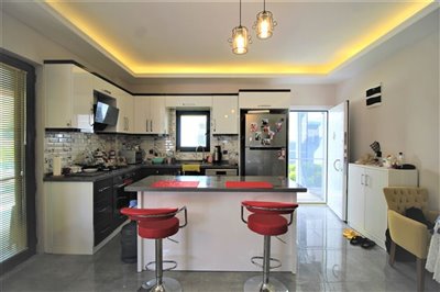 Stunning Triplex Villa For Sale in Didim - Fully fitted modern kitchen with breakfast bar