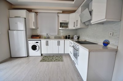 Ideally Located Fethiye Apartment For Sale - A crisp white modern kitchen
