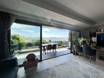 Sea View Bodrum Apartment In Bardakci Koyu For Sale – Huge windows opening to a large balcony with sea views