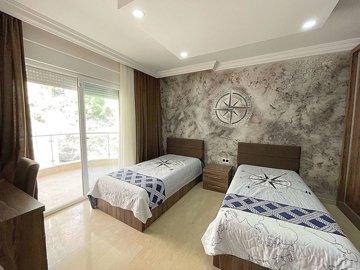 A Hillside Apartment In Alanya For Sale - A good-sized twin bedroom with balcony