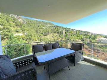 A Hillside Apartment In Alanya For Sale - Shady balcony surrounded by lush nature