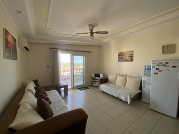 Fully Furnished Duplex Apartment In Didim For sale - Spacious lounge area leading to the balcony
