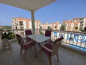 A Must-See Fully Furnished Apartment In Didim For sale - Spacious balcony overlooking one of the pools
