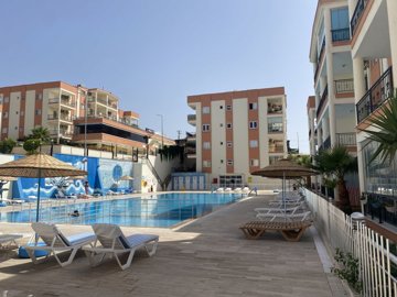 A Must-See Fully Furnished Apartment In Didim For sale - Ample sun terraces and loungers