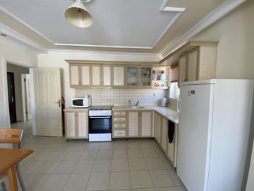 A Must-See Fully Furnished Apartment In Didim For sale - Fully fitted kitchen with white goods included