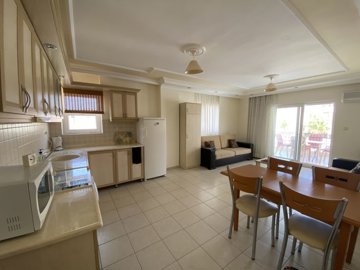 A Must-See Fully Furnished Apartment In Didim For sale - A lovely living space with a large balcony