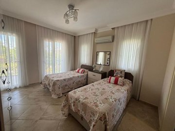 A charming Dalyan Private Villa For Sale With Pool - Large twin bedroom with ensuite and balcony