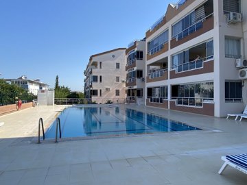 An Unmissable Two-Bed Apartment In Didim For sale - View to the modern apartment block and communal pool