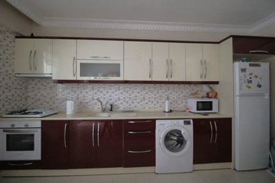 An Unmissable Two-Bed Apartment In Didim For sale - Kitchen with built-in white goods