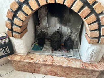 A Charming Traditional Dalyan Property For Sale - Brick fireplace next to the dining area