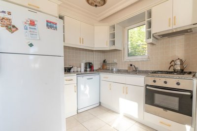 A Minimalistic Attic Duplex Apartment in Gocek For Sale - Fully fitted stylish kitchen with white goods