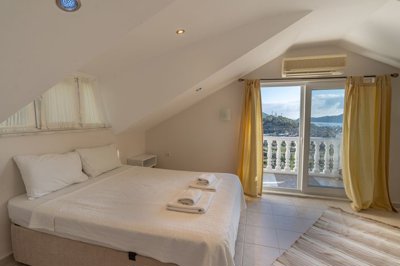 A Minimalistic Attic Duplex Apartment in Gocek For Sale - A light and airy modern bedroom