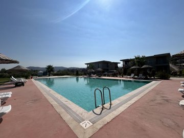 A Modern Bodrum Apartment For Sale On a Small Complex - An enticing pool with large sun terraces