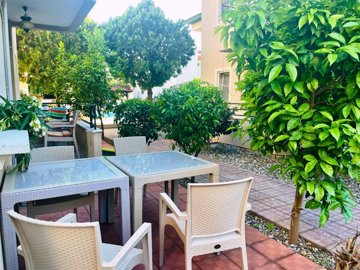 A well-maintained Apartment For Sale Close To Town In Dalyan - Seating in the pretty gardens