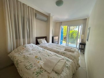 An Outstanding Bodrum Property For Sale - A spacious first bedroom with garden access