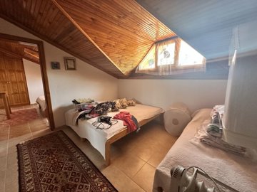 A Traditional Country House For Sale In Turkey - Spacious bedroom with wooden ceilings