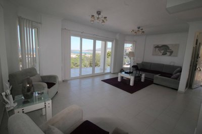 A Detached Triplex Sea View Villa in Akbuk For Sale - Lounge space with terrace access and sea views