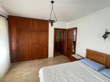 A Traditional Dalyan Property For Sale In Turkey - Bedroom with ornate lighting and storage