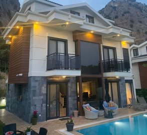 Detached Luxurious Triplex Fethiye Villa For Sale - Main view of the villa with pool and sun terraces