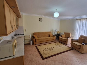 A Good-Sized 3-Bedroom Didim Property For Sale – Lounge and open-plan kitchen on the upper floor