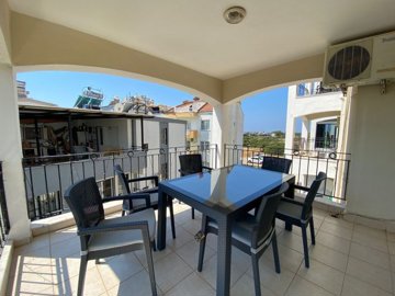 Great Location Didim Apartment For Sale – Shady balcony with seating set