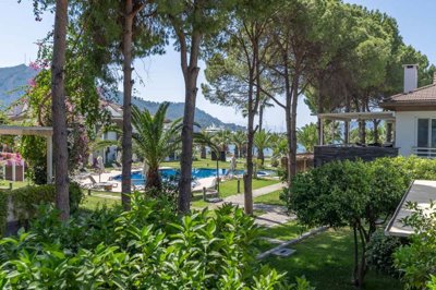 A Seafront Duplex Apartment For Sale in Fethiye - Beautiful gardens with partial sea views