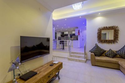 A Glamorous 4-Bedroom Fethiye Property For Sale - A gorgeous living room through to the kitchen