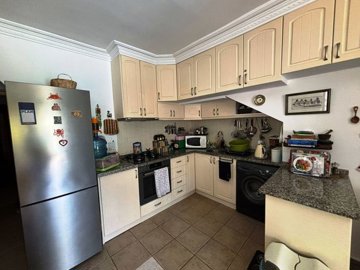 Must-View Ground Floor Apartment For Sale In Dalyan - Kitchen installed with all white goods