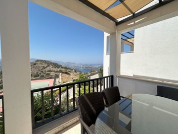 An Elegant Sea View Apartment For Sale In Bodrum - Exterior dining area with sea views