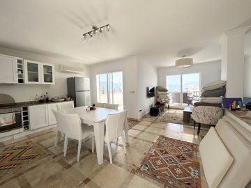 An Elegant Sea View Apartment For Sale In Bodrum - Large open-plan living space