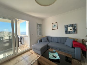 An Elegant Sea View Apartment For Sale In Bodrum - Lounge area leading to the terrace 