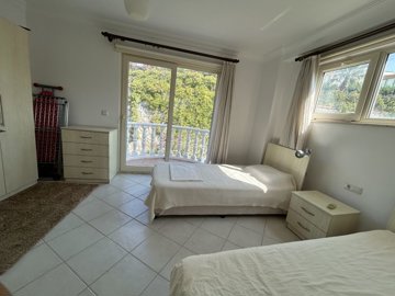 A Pretty Bodrum Apartment For Sale In Mugla, Milas - Twin bedroom with a little balcony