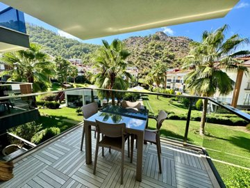 A Stylish Key-Ready Fethiye Property For Sale – Shady balcony overlooking the beautifully landscaped gardens