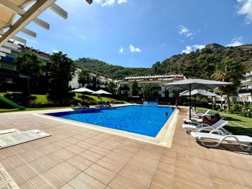 A Stylish Key-Ready Fethiye Property For Sale – A large communal pool and sun terraces along with gardens