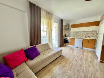 A Stylish Key-Ready Fethiye Property For Sale – Lounge and fully fitted kitchen