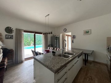 A Traditional Stone Villa And Guest House For Sale In Bodrum - Kitchen features an island and views of the pool