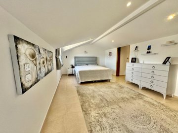 Ready-To-Move Apartment For Sale In Ovacik, Fethiye – Large master bedroom on the top floor