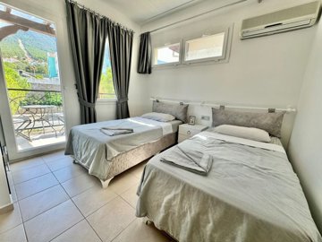 Ready-To-Move Apartment For Sale In Ovacik, Fethiye – Second bedroom, a twin room with a balcony