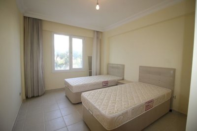 Delightful Furnished Apartment For Sale In Altinkum – Spacious bedroom with ensuite bathroom