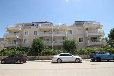 Delightful Furnished Apartment For Sale In Altinkum – Apartment block from the street