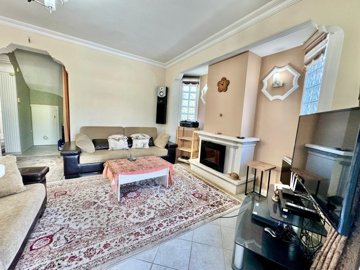 A Traditional Ready To Move Detached Villa In Fethiye For Sale - Spacious lounge with fireplace