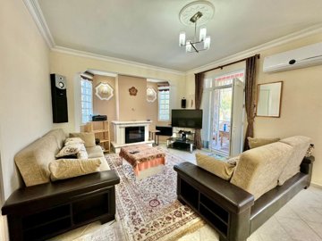 A Traditional Ready To Move Detached Villa In Fethiye For Sale - A large living room with fireplace