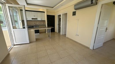 A Bright & Airy Apartment In Antalya For Sale - Lounge through to the kitchen