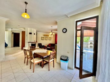 A Charming Detached Villa For Sale In Fethiye - Dining area with garden access