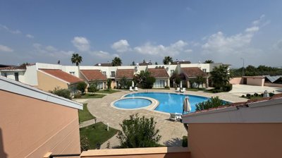 An Immaculate Apartment In Belek, Antalya For Sale - View from the balcony over the communal areas and pool