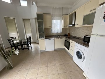 A Charming Two-Bed Apartment In Belek For Sale - Kitchen through to the dining area