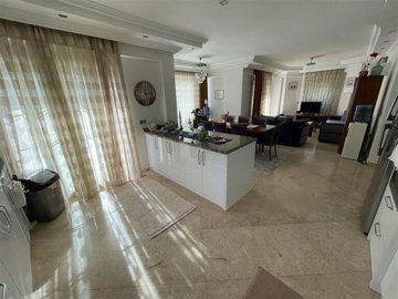 A Glamorous Villa With A Private Pool For Sale in Belek, Antalya - A massive kitchen through to the lounge